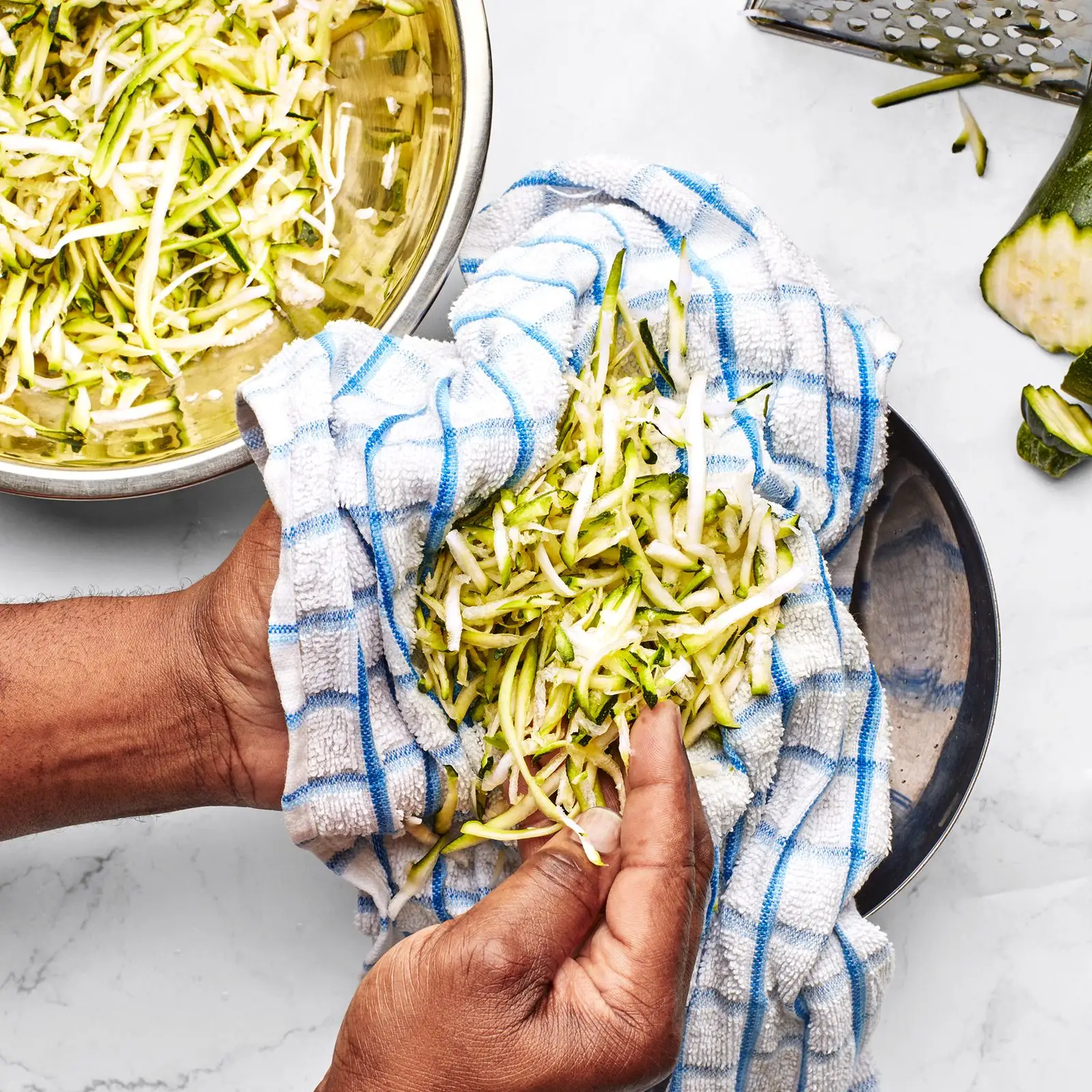 shredded zucchini wrapped in a towel to wring out moisture