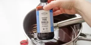 Adding the vanilla extract to the boiled chocolate syrup.' title='Chocolate Syrup for Coffee Recipe
