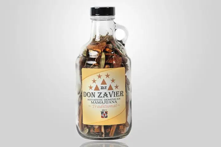 A glass jug of Don Zavier Mamajuana mix