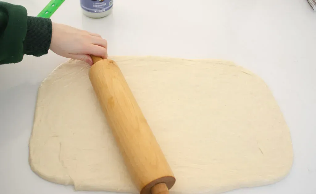 Rolling the dough for these easy cinnamon rolls into a large rectangle. ' title='Cinnamon Roll Recipe Without Milk