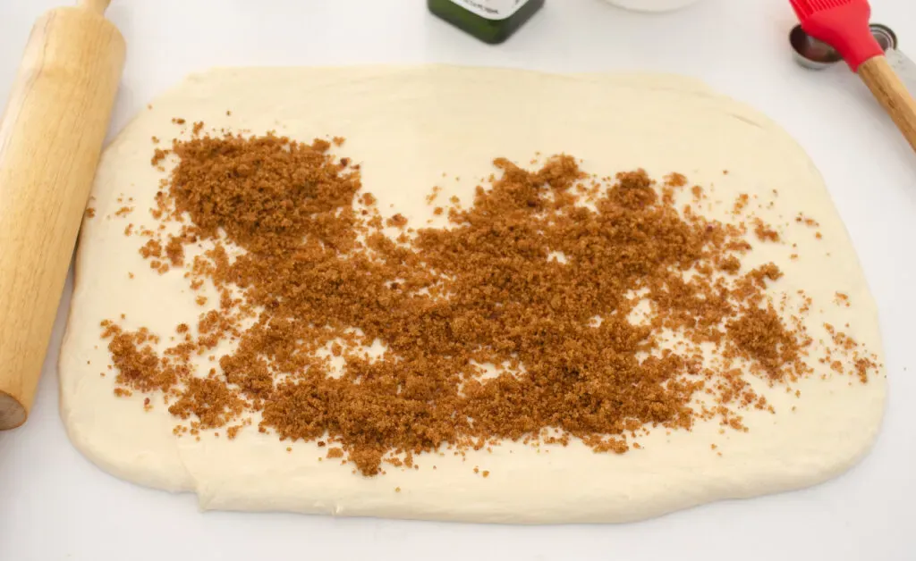 Sprinkling the dough with the cinnamon sugar mixture. ' title='Cinnamon Roll Recipe Without Milk