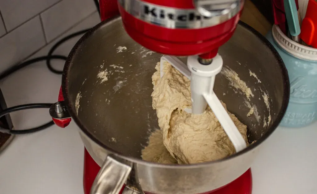 Placing the dough for the dairy free cinnamon rolls on the stand mixer base to knead. ' title='Cinnamon Roll Recipe Without Milk