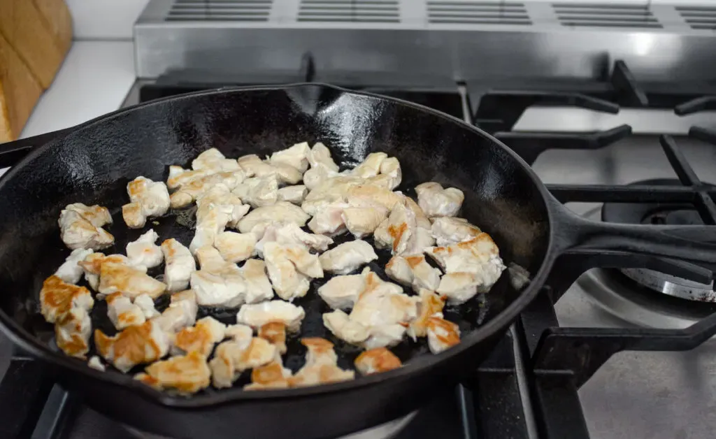 Cooking the chicken in a cast iron skillet for the stir fry. ' title='Healthy Chicken Stir Fry Recipe
