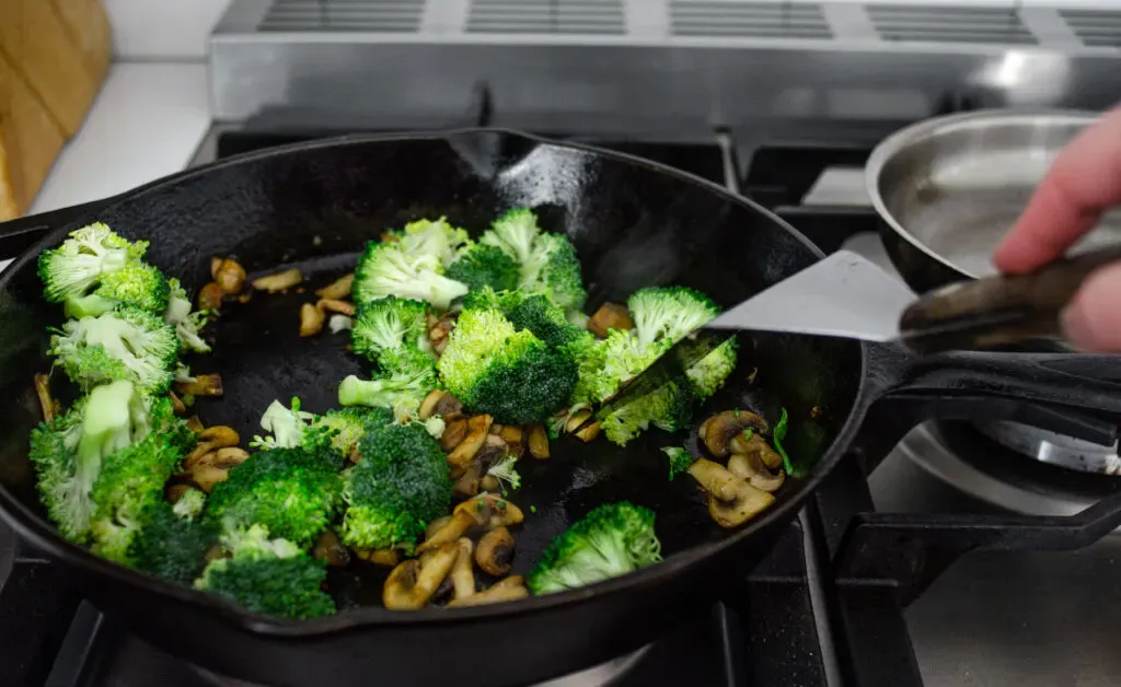 Adding the broccoli florets to the skill to sauté. ' title='Healthy Chicken Stir Fry Recipe