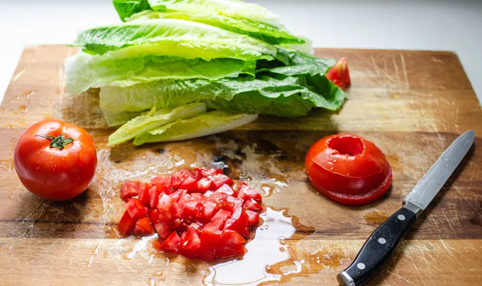 Chopping the tomatoes. ' title='BLT Bowtie Pasta Salad