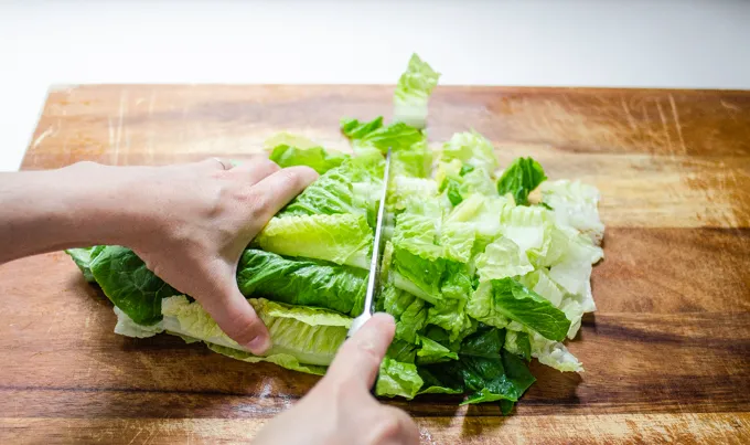 Chopping the lettuce.' title='BLT Bowtie Pasta Salad
