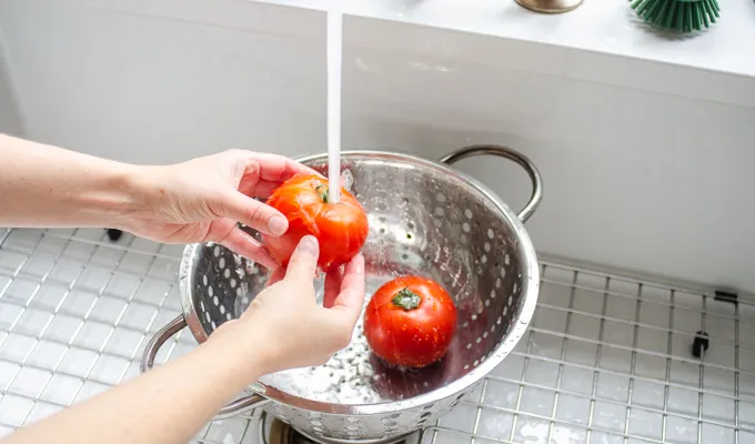 Washing tomatoes.' title='BLT Bowtie Pasta Salad