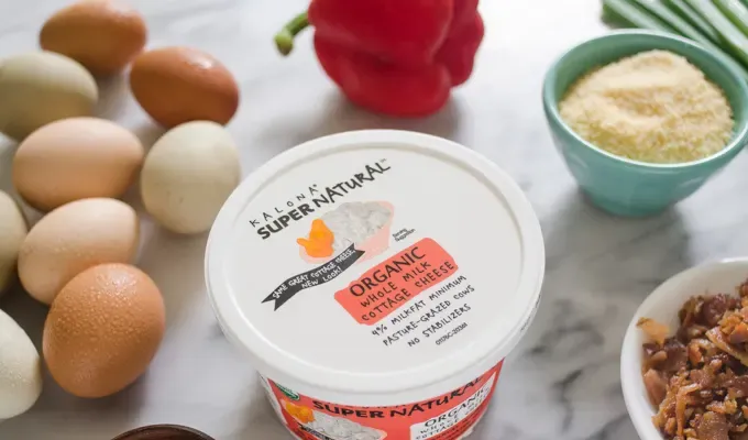 Photo of Kalona SuperNatural cottage cheese with muffin ingredients around it.' title='Egg Muffin Cups with Cottage Cheese Bacon and Peppers