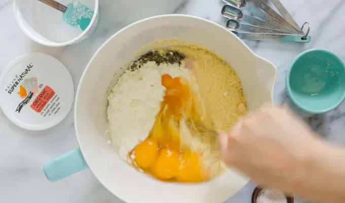 Whisking together the ingredients.' title='Egg Muffin Cups with Cottage Cheese Bacon and Peppers