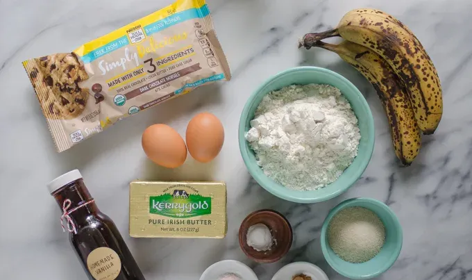 Ingredients on a marble surface.' title='Sourdough Banana Bread