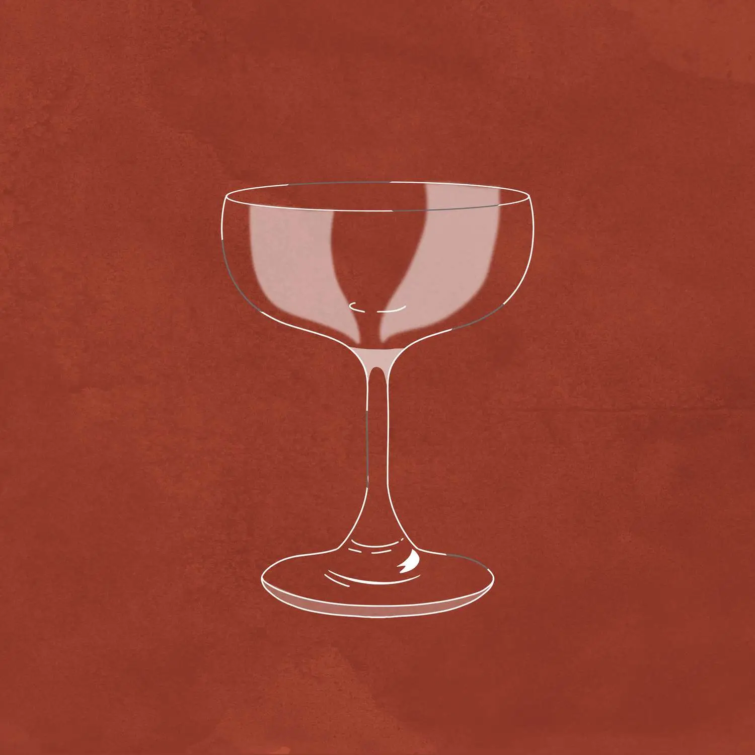 Coupe glass against a red background