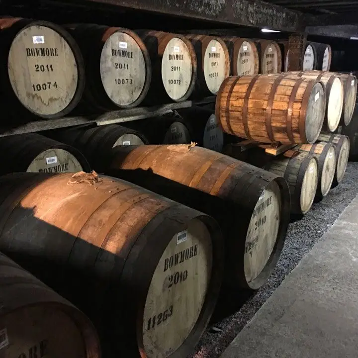 Bowmore Distillery and a few barrels in its storehouses