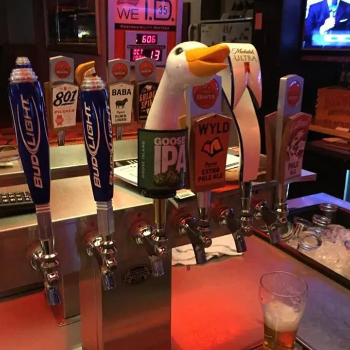 Bongo Lounge. a row of beer taps with a Goose IPA at the center