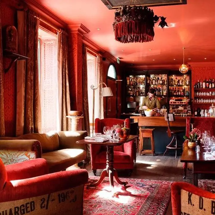 The Zetter Townhouse Clerkenwell interior with cozy brick-red decor