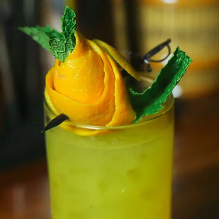 Orange peel and mint sprig rose garnish