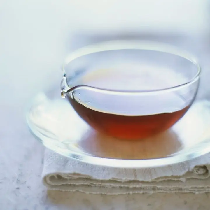 A small glass pitcher containing agave nectar