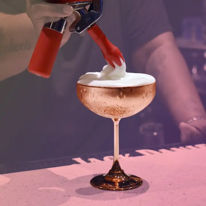 Using a whipped cream dispenser as a bartending tool