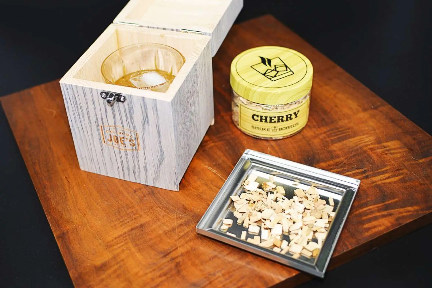 Oklahoma Joes kit sitting on wood table with black background