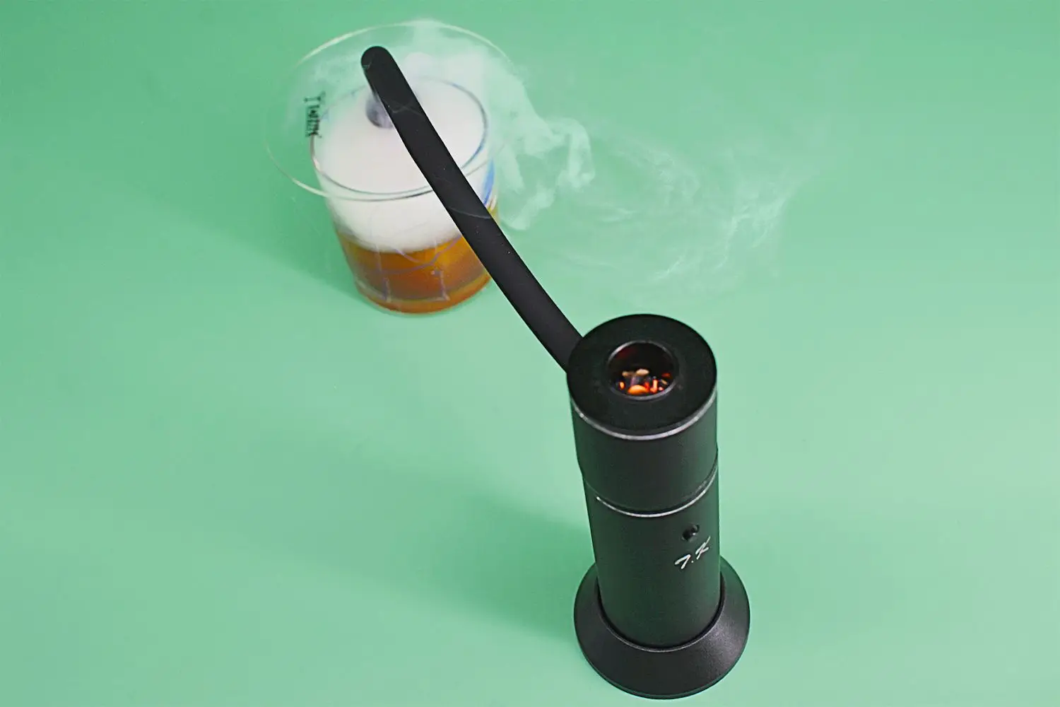 TMKEFFC smoker end inside glass on green table