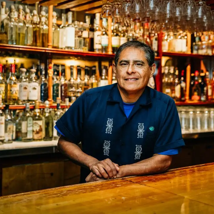 Julio Bermejo behind bar of Tommy