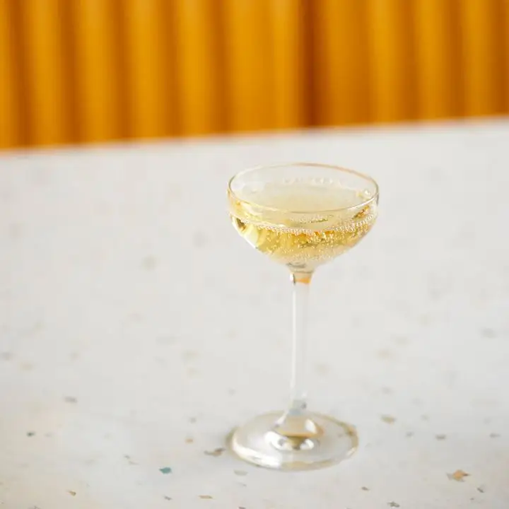 Cocktail made with Krug Champagne, water jelly and spiked herbs