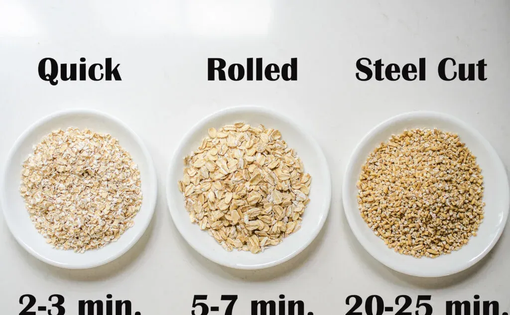 Quick cooking oats rolled oats and steel cut oats laid out in white bowls on a countertop.' title='Blueberry Oatmeal Recipe