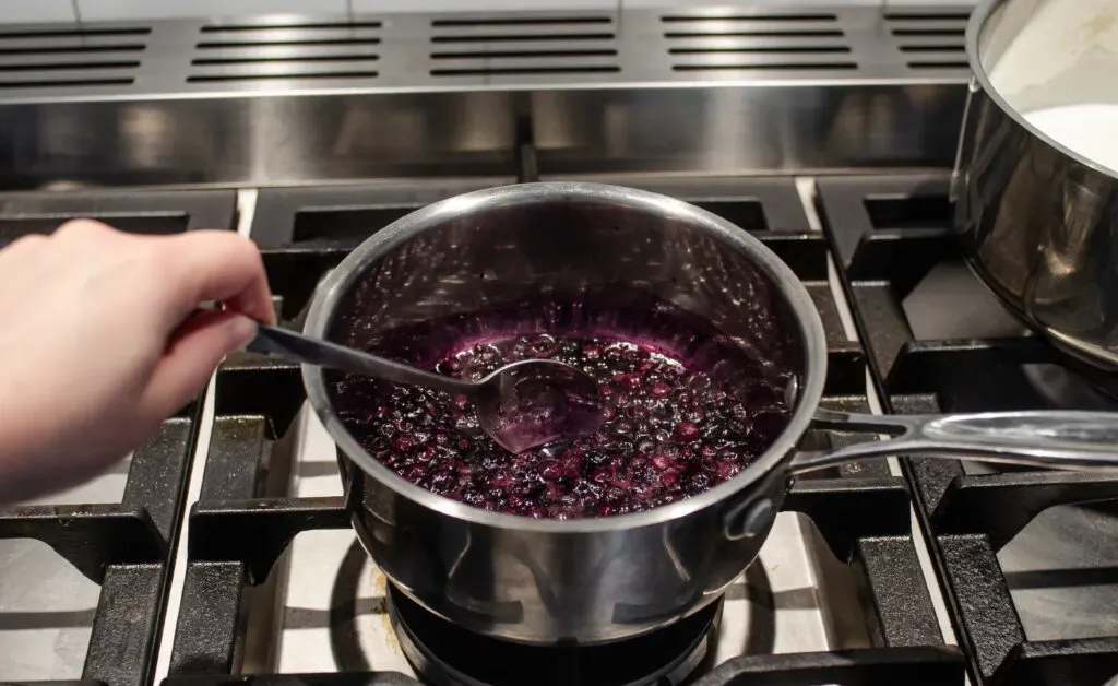 Making a compote with the blueberries and sweetener.' title='Blueberry Oatmeal Recipe