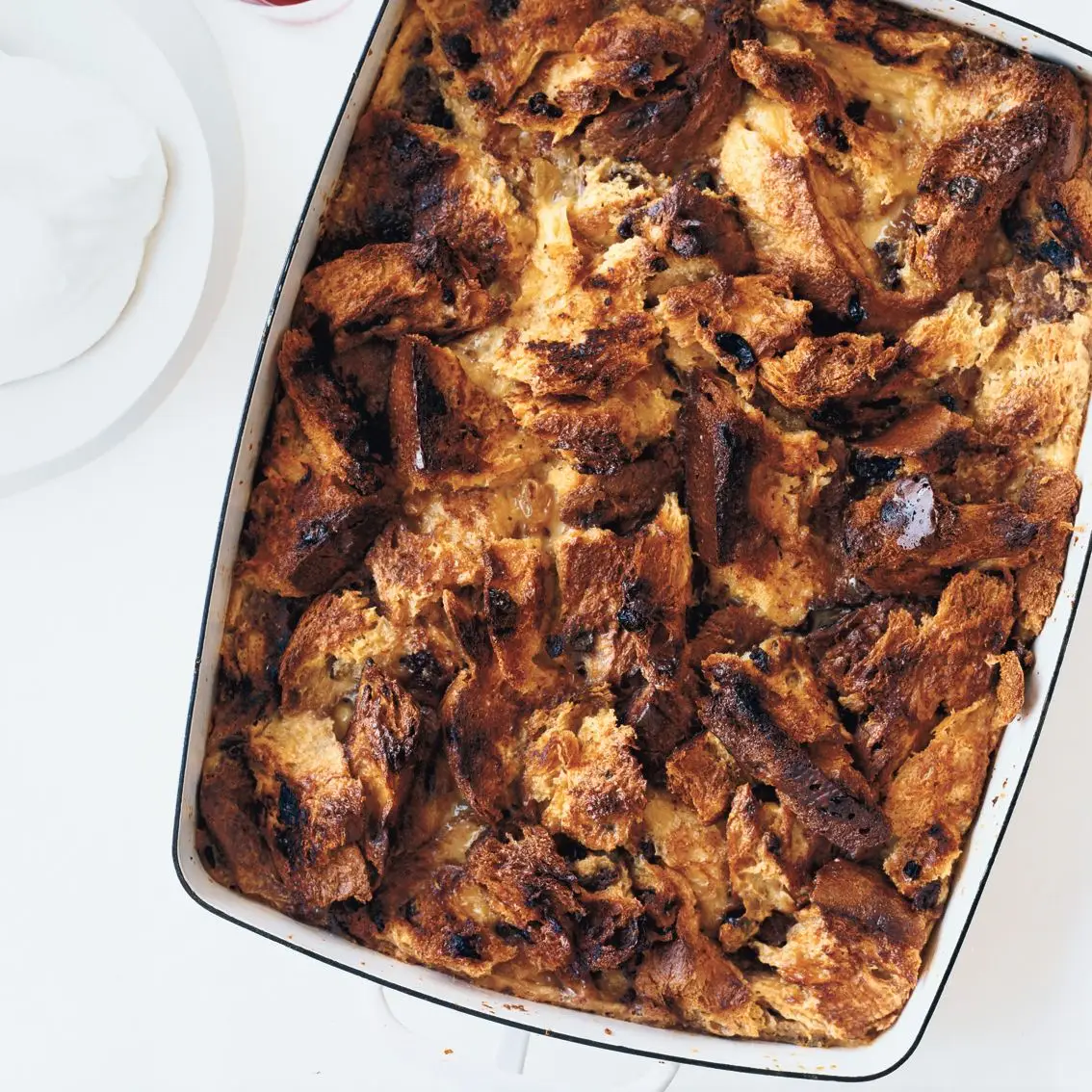 Panettone bread pudding recipe in a white rectangular casserole dish.