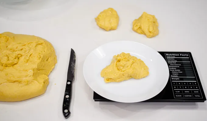 Weighing out individual pieces of dough.' title='Pumpkin Sourdough Dinner Rolls