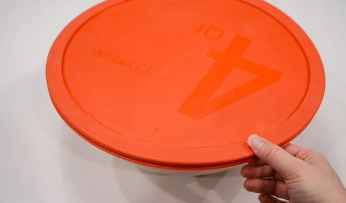 Putting the lid on the dough for the first rise.' title='Pumpkin Sourdough Dinner Rolls