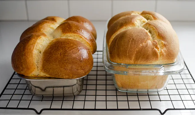 The baked loaves of sourdough brioche cooling on a wire rack.' title='Sourdough Brioche