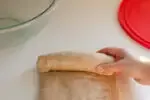 Forming the loaf of sourdough bread by rolling it up like a jellyroll.' title='Healthy Whole Wheat Sourdough Sandwich Bread