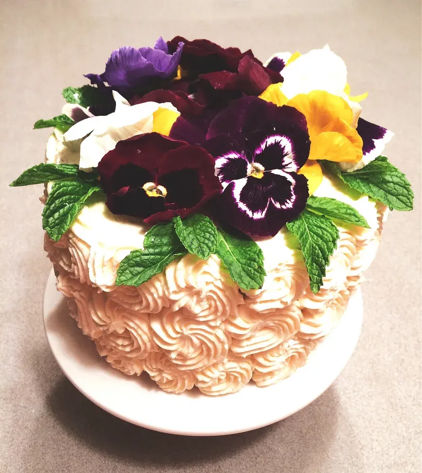 Triple Lemon Layer Cake | Buttered Side Up' title='Triple Lemon Naked Layer Cake with Edible Flowers