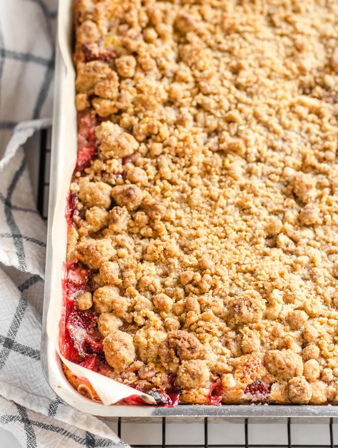 A pan of strawberry rhubarb cake.' title='Strawberry Rhubarb Crumb Cake