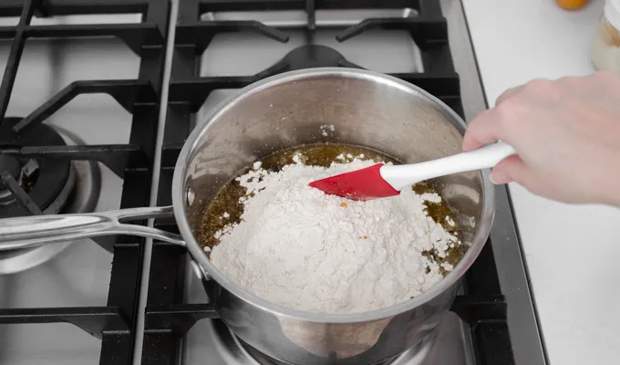 Adding the flour to the crumb topping.' title='Strawberry Rhubarb Crumb Cake