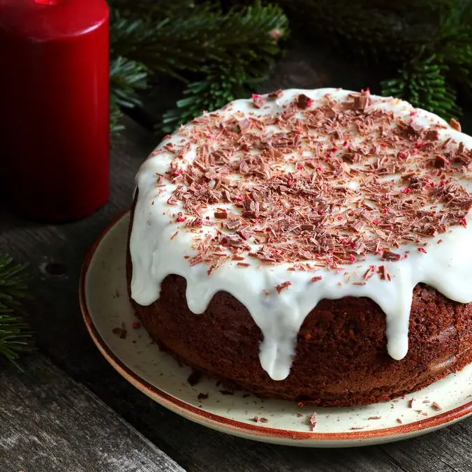 Bolo de caqui com cobertura de creme de queijo