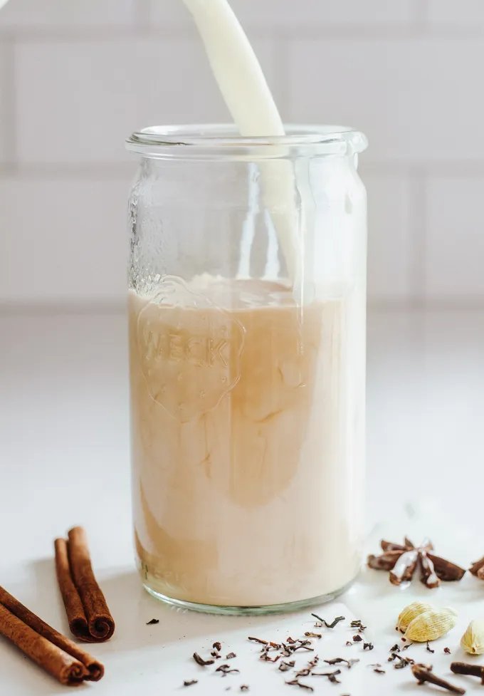 Pouring milk on top.' title='Iced Chai Latte Recipe