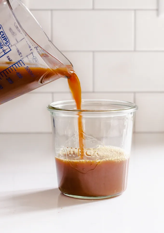 Pouring the concentrate into a Weck jar.' title='Iced Chai Latte Recipe