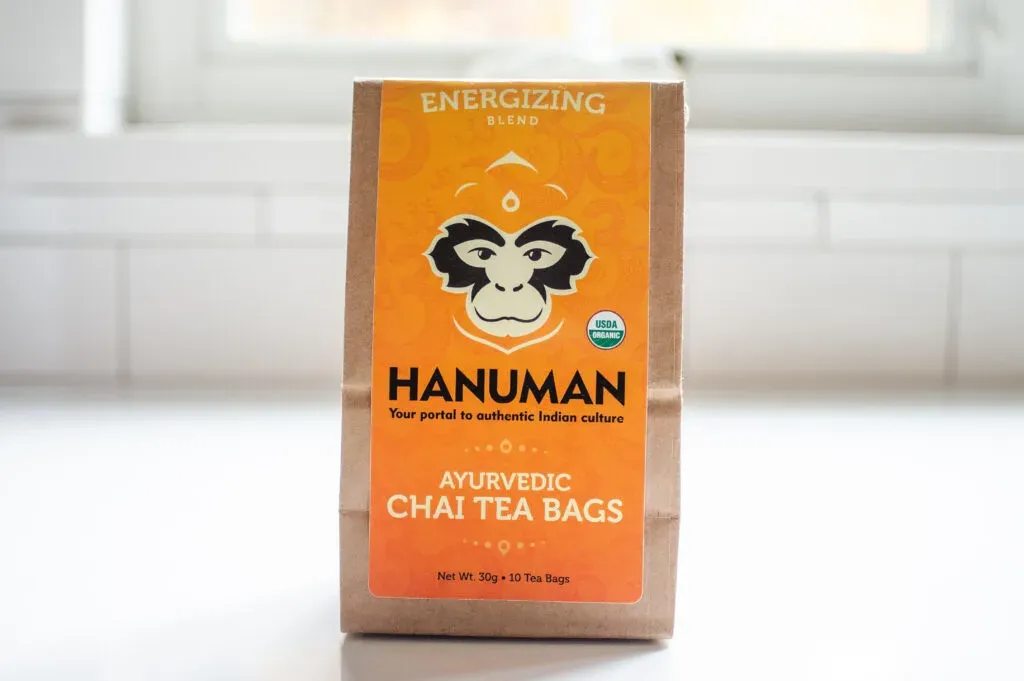 Hanuman Ayurvedic Chai Tea energizing flavor on a white countertop.' title='Best Organic Chai Tea