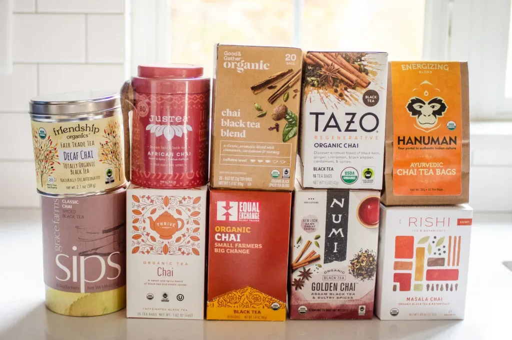 10 different organic chai tea brands stacked on top of each other on a white countertop.' title='Best Organic Chai Tea