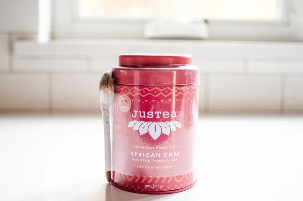 JusTea African chai tea on a white countertop with a window in the background.' title='Best Organic Chai Tea