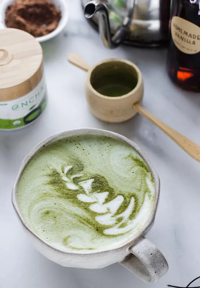 A mug of matcha hot chocolate made with cocoa powder.' title='Matcha Cocoa