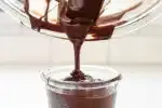 Pouring the chocolate into a glass for dipping the buckeyes.' title='Buckeye Recipe Without Shortening