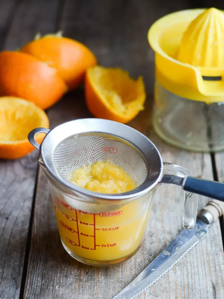 Juicing fresh oranges.' title='Orange Scones