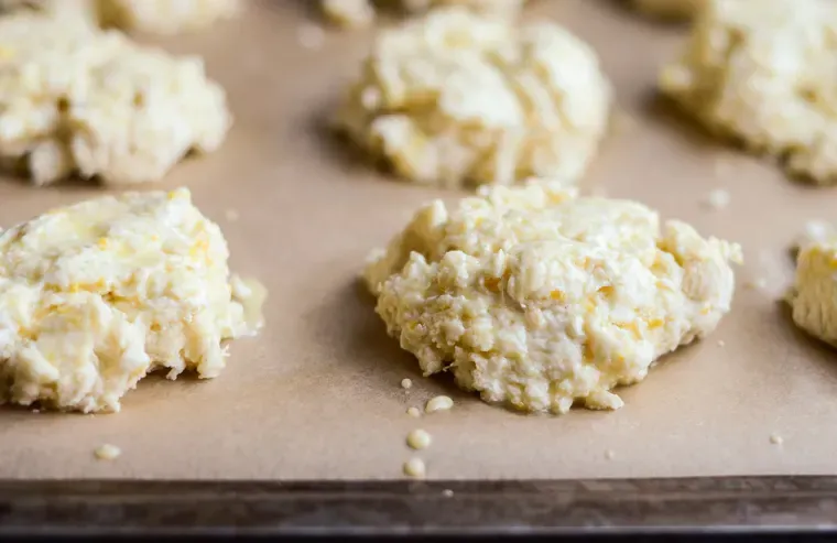 The scones resting on the prepared cookie sheet. ' title='Orange Scones