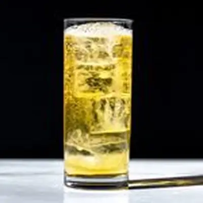 Golden-hued Whiskey Highball in tall highball glass with carbonated bubbles rising, on dark solid background
