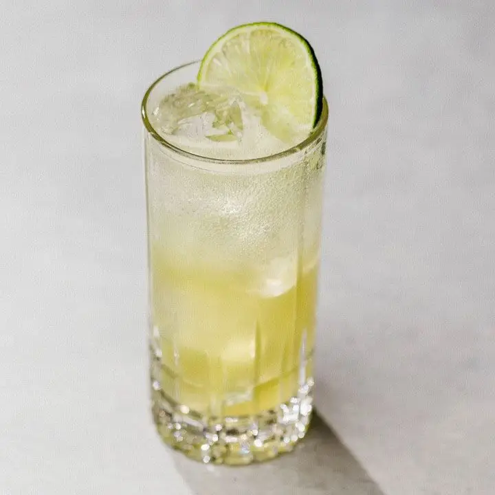 Mint-Basil Limeade with ice in a Collins glass, garnished with a lime wheel