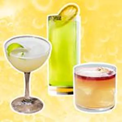 Sour cocktails against a yellow background with bubbles