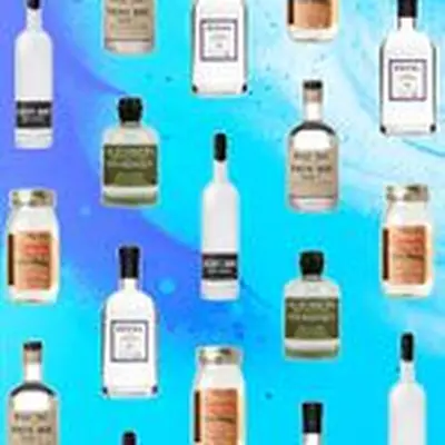 A collage of unaged whiskey bottles