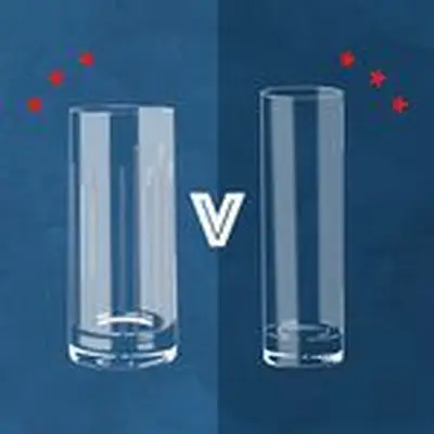 Illustration of a wider Collins glass and narrower highball glass side by side, with versus sign between them